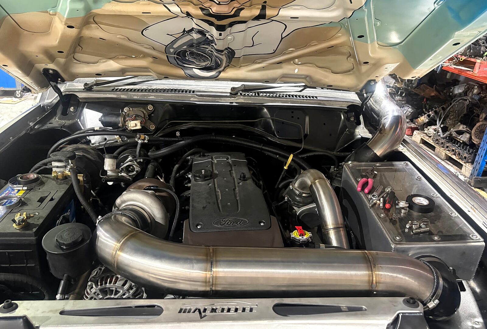 Engine bay of a Nissan Patrol with a GC Patrols turbo Barra conversion