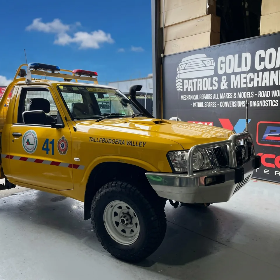 Yellow Tallebudgera Rural Fire Brigade Nissan Patrol ute outside GC Patrols