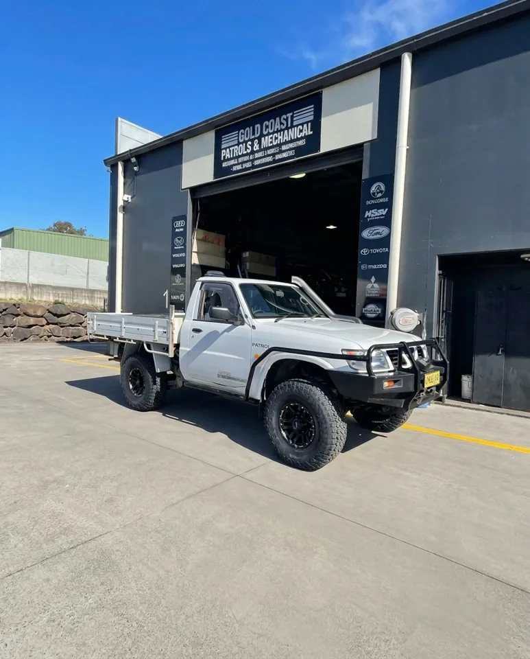White L98-converted GU Nissan Patrol ute outside GC Patrols