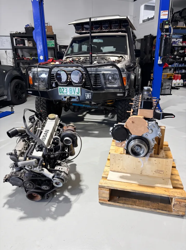 Clean GQ Nissan Patrol in the workshop with TD42 engines in front